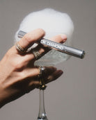 silverdiamondandjewellerycleaningpeninhandwithdiamondsandcup